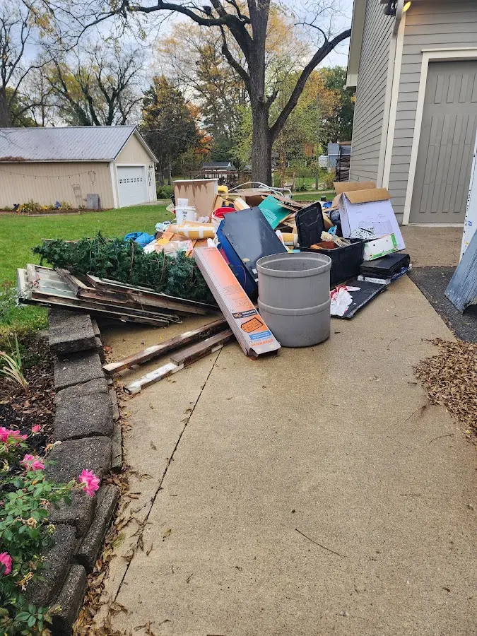 Dumpster being loaded with debris for Demolition Dumpster Rental in Nockamixon